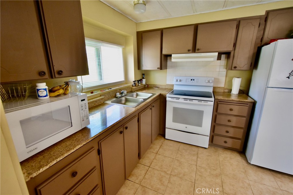 14804 Oregon Road Hornbrook, CA 96044 - Photo 8 of 26 a kitchen with a stove and a sink