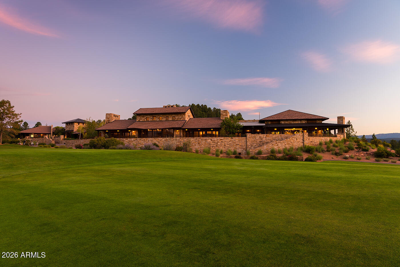 3103 East Game Trail, Unit 253 Payson, AZ 85541 - Photo 4 of 12 a view of a big house with a big yard and a large trees