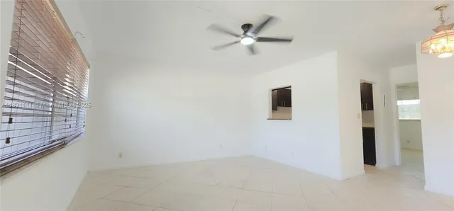 a view of a livingroom with a ceiling fan