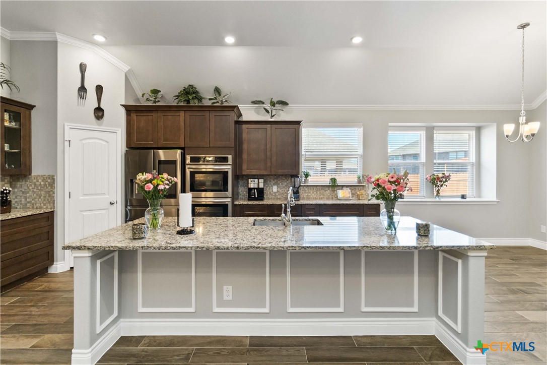 8402 Ridge Crest Drive Killeen, TX 76542 - Photo 12 of 34 a view of kitchen with stainless steel appliances granite countertop a refrigerator and microwave