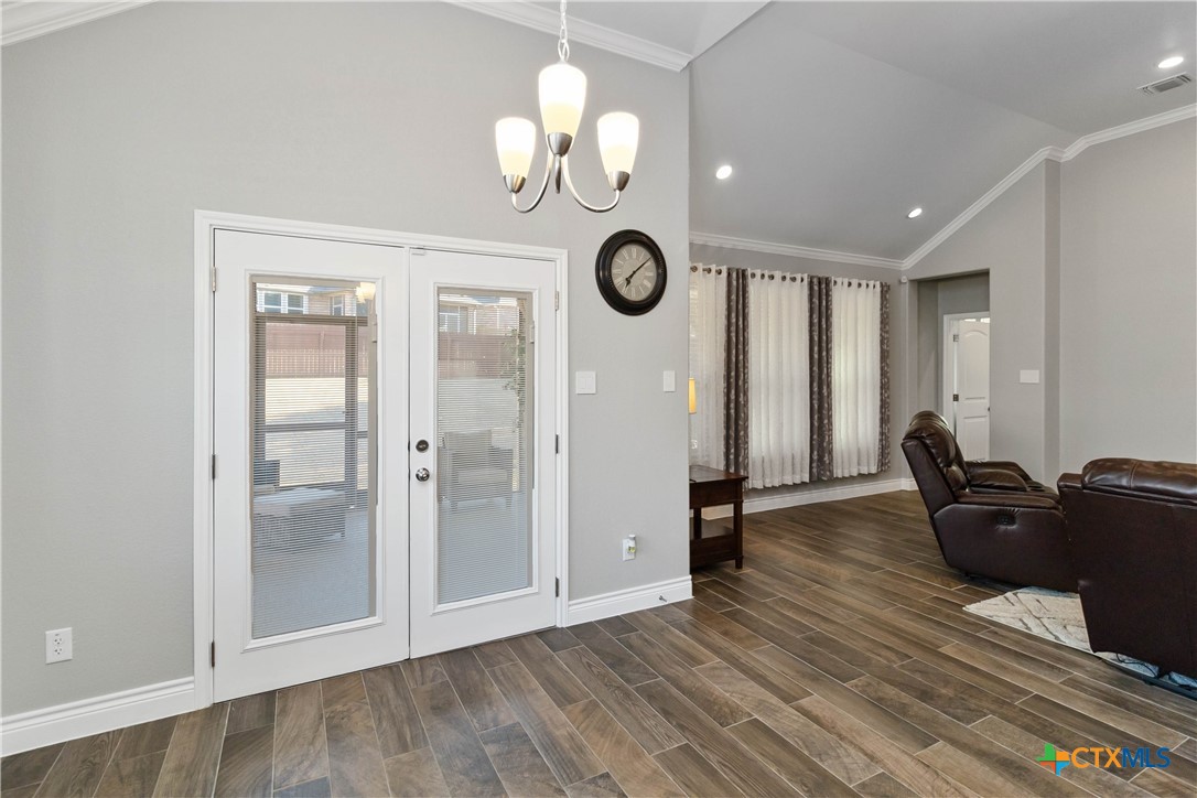 8402 Ridge Crest Drive Killeen, TX 76542 - Photo 18 of 34 a view of a livingroom with furniture wooden floor and a ceiling fan