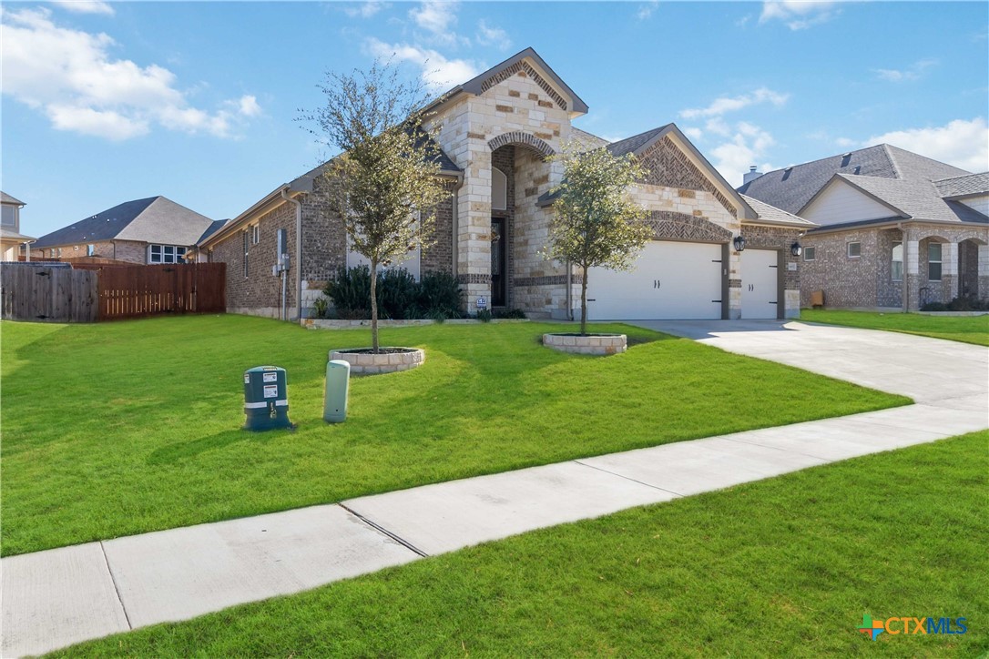 8402 Ridge Crest Drive Killeen, TX 76542 - Photo 2 of 34 a view of a house with a big yard and large tree