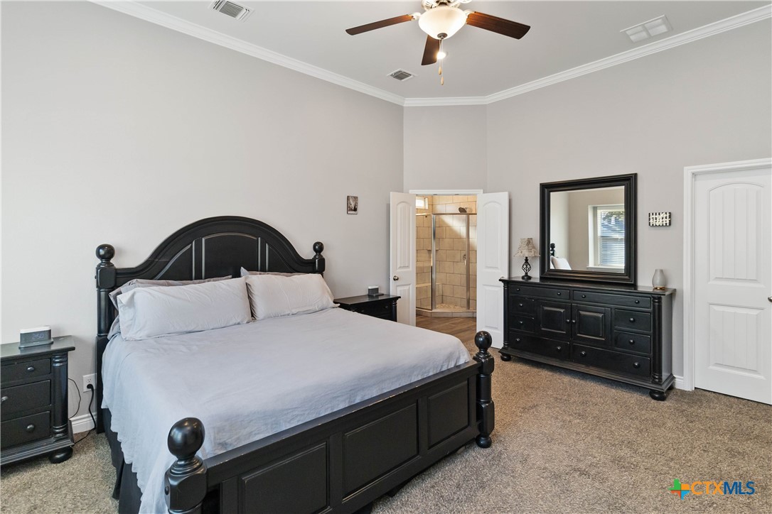 8402 Ridge Crest Drive Killeen, TX 76542 - Photo 21 of 34 a bedroom with a bed and a dresser