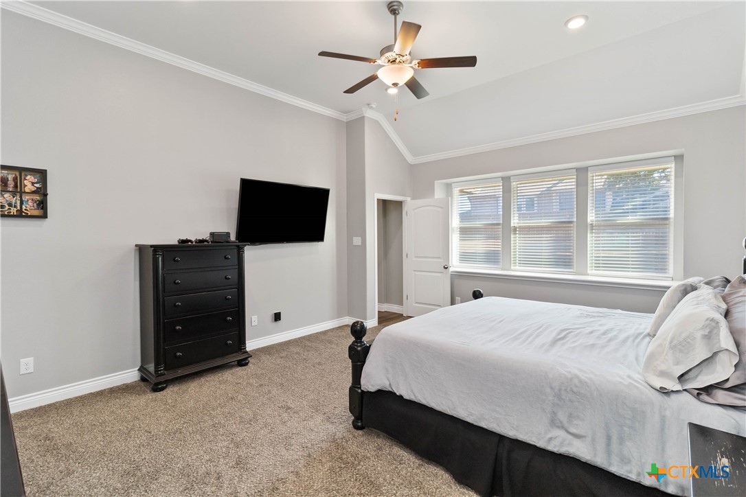8402 Ridge Crest Drive Killeen, TX 76542 - Photo 22 of 34 a bedroom with a bed and a flat screen tv