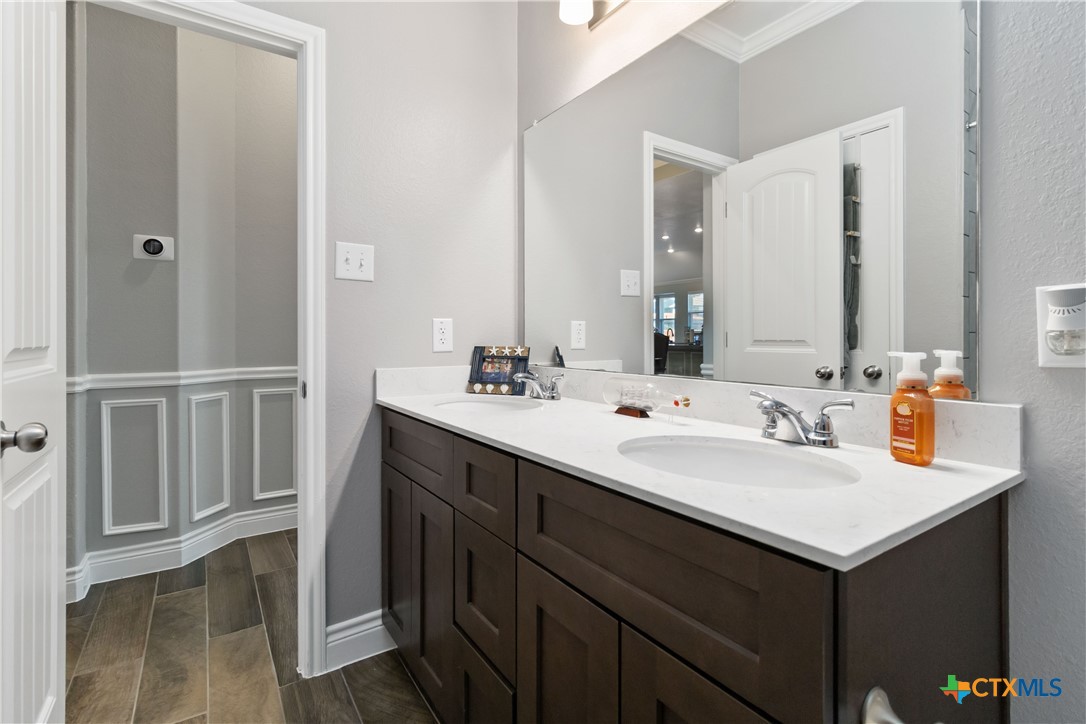 8402 Ridge Crest Drive Killeen, TX 76542 - Photo 27 of 34 a bathroom with a sink and a mirror