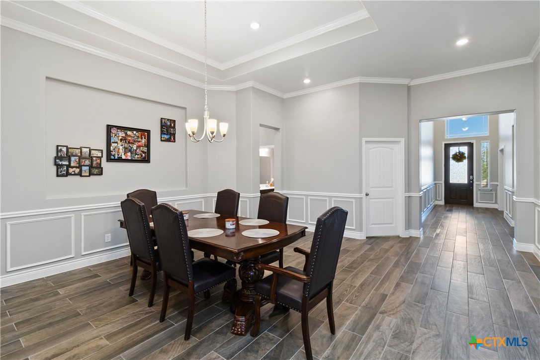 8402 Ridge Crest Drive Killeen, TX 76542 - Photo 5 of 34 a view of a dining room with furniture and wooden floor