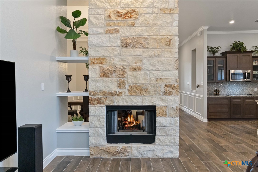 8402 Ridge Crest Drive Killeen, TX 76542 - Photo 9 of 34 a living room with furniture and a fireplace