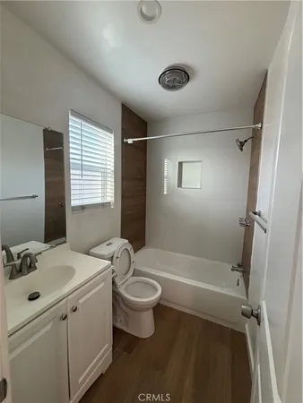 a bathroom with a sink toilet tub and shower