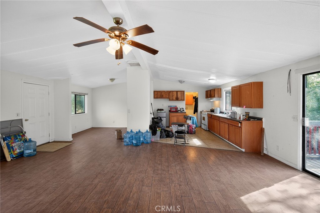 3804 Owl Creek Road Mariposa, CA 95338 - Photo 8 of 18 a view of a room with wooden floor and ceiling fan