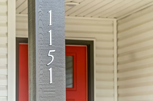 a bathroom with a shower and a mirror
