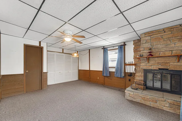 a view of an empty room with a fireplace
