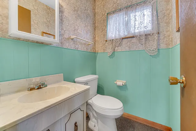 a bathroom with a sink and a toilet
