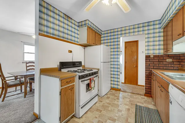 a kitchen that has a stove and a table