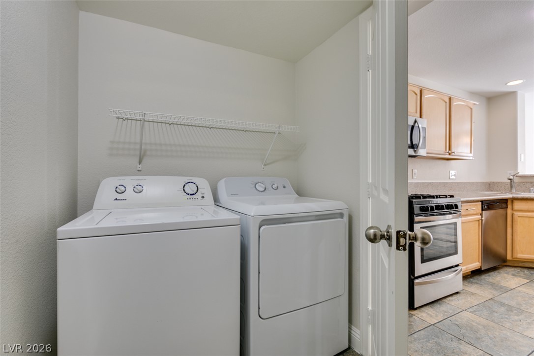 200 Luninborg Street Henderson, NV 89074 - Photo 10 of 40 Functional laundry nook provides practical convenience.