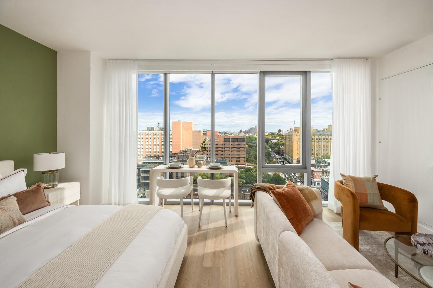 89 DeKalb Avenue, Unit 12T Brooklyn, NY 11201 - Photo 2 of 17 a living room with furniture and a large window