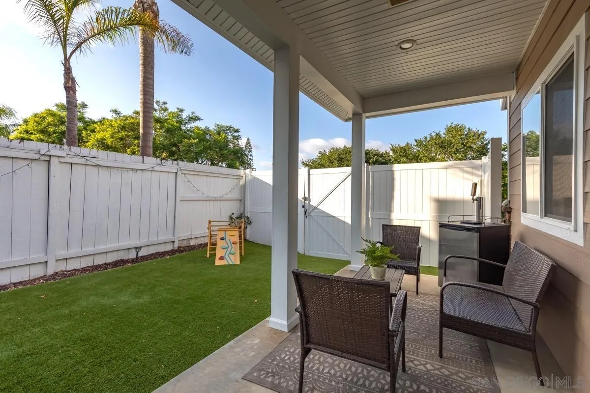 1448 Third Street Coronado, CA 92118 - Photo 13 of 30 a backyard of a house with table and chairs