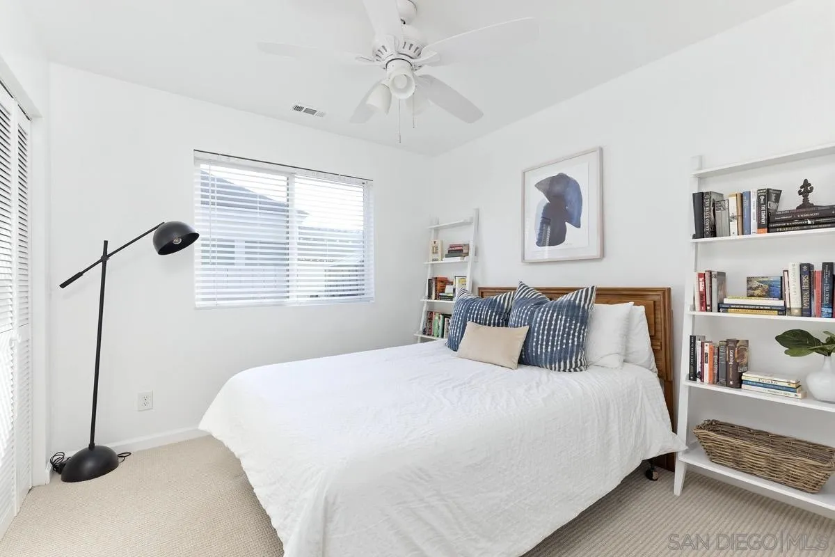 1448 Third Street Coronado, CA 92118 - Photo 14 of 30 a bedroom with a bed and a window