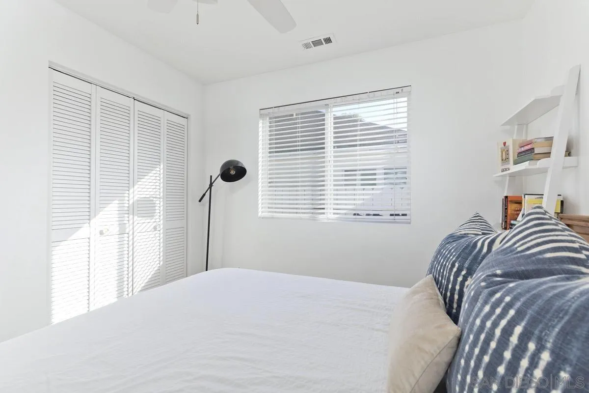 1448 Third Street Coronado, CA 92118 - Photo 15 of 30 a bedroom with a bed and a window