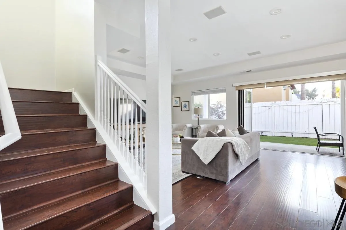1448 Third Street Coronado, CA 92118 - Photo 21 of 30 a spacious bedroom with wooden floor and windows
