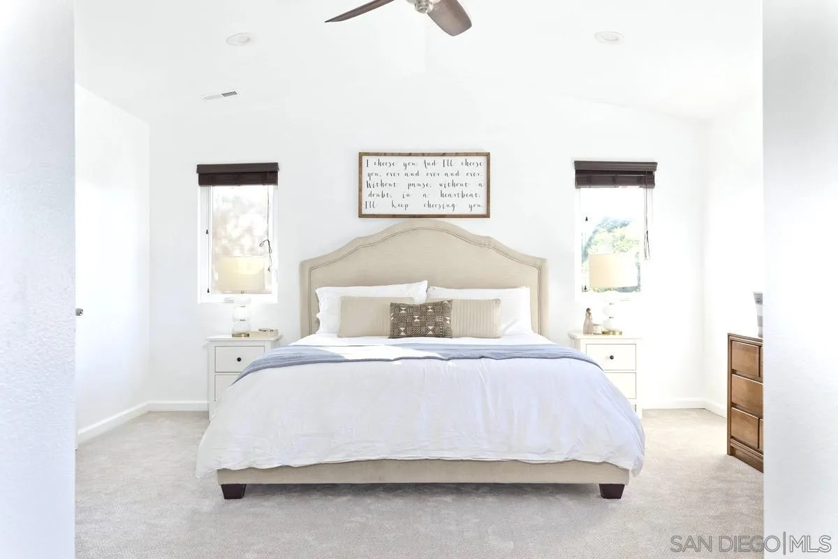 1448 Third Street Coronado, CA 92118 - Photo 22 of 30 a bedroom with a bed and a painting on the wall