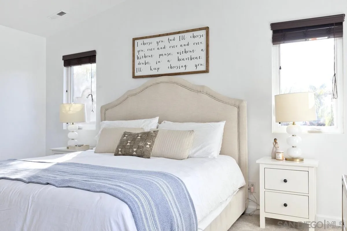 1448 Third Street Coronado, CA 92118 - Photo 24 of 30 a bedroom with a bed and a window