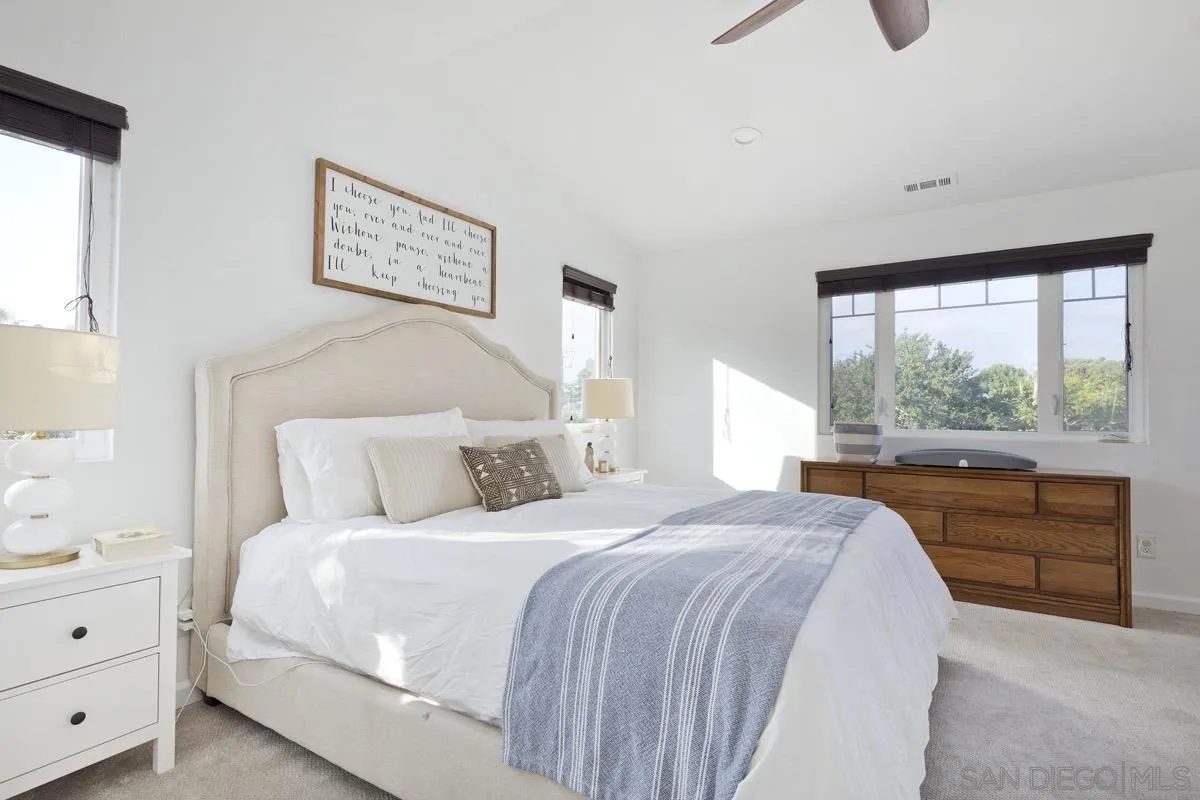 1448 Third Street Coronado, CA 92118 - Photo 25 of 30 a bedroom with a bed and a large window