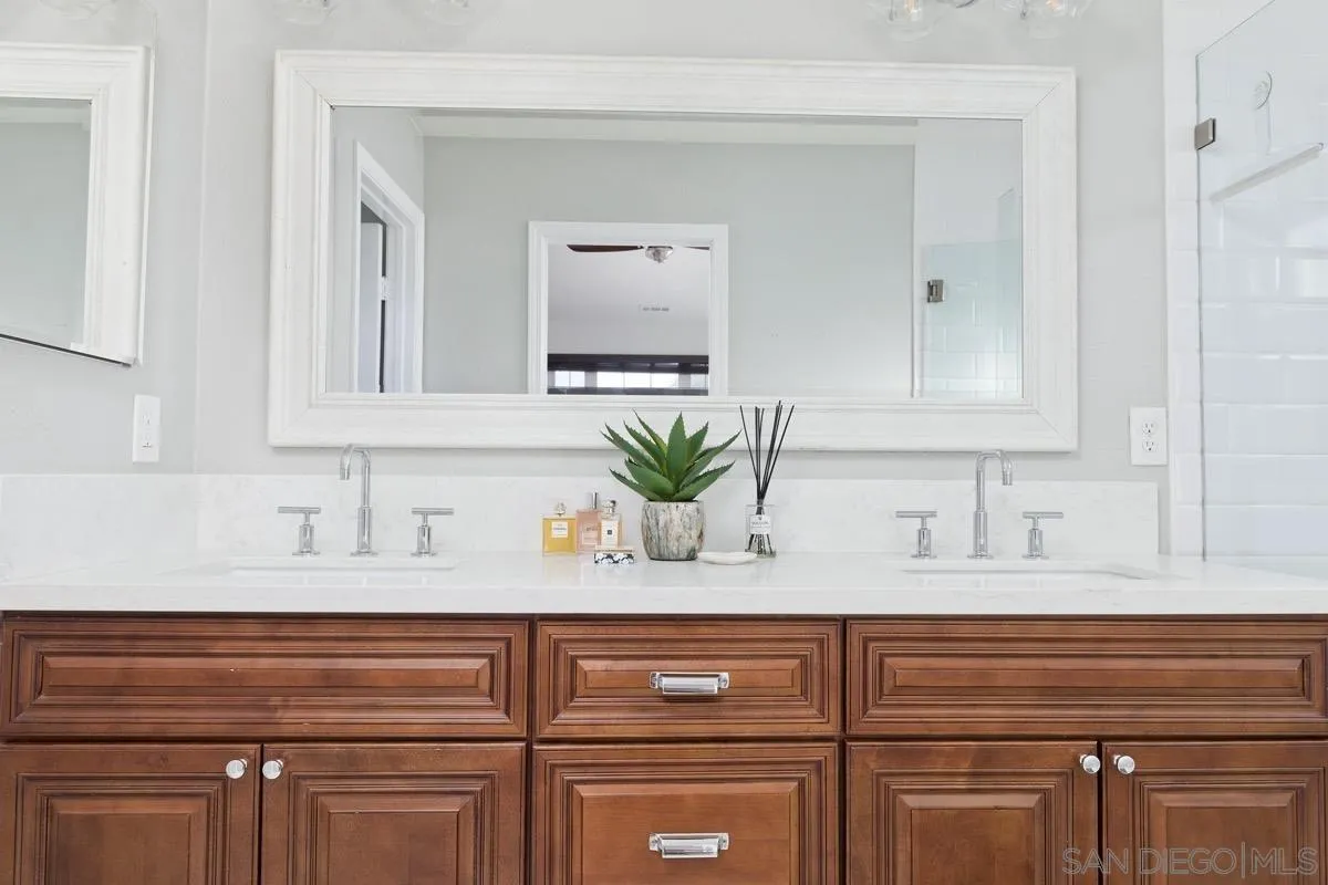 1448 Third Street Coronado, CA 92118 - Photo 28 of 30 a bathroom with a sink and a mirror