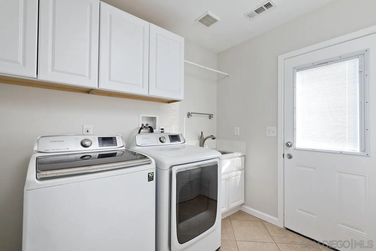 1448 Third Street Coronado, CA 92118 - Photo 30 of 30 a utility room with dryer and washer