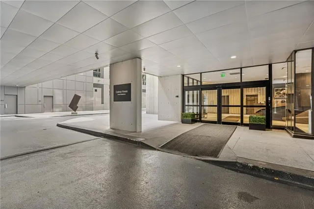 a view of a livingroom with furniture and a window