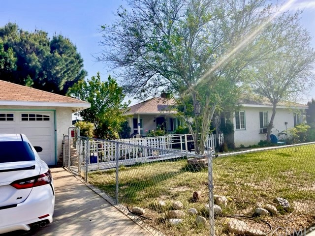 249 South Rexford Street Rialto, CA 92376 - Photo 1 of 1 a view of a house with backyard porch and sitting area