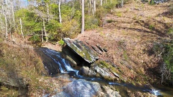 a view of a backyard with chairs
