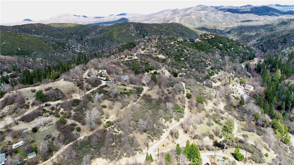 0 Walnut Drive Cedar Glen, CA 92321 - Photo 22 of 34 a view of a house with a mountain in the background