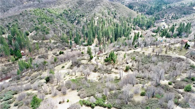 a view of a yard covered with snow in the background
