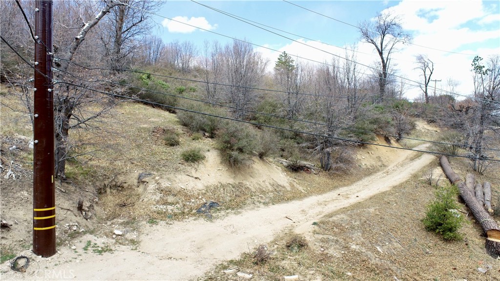0 Walnut Drive Cedar Glen, CA 92321 - Photo 30 of 34 a view of a yard covered with snow in the background
