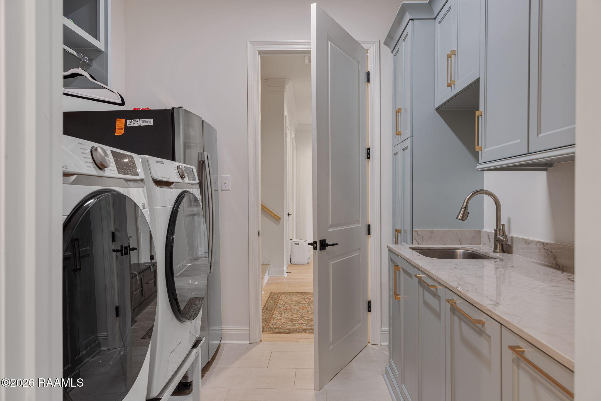 209 Stoney Shadow Drive Lafayette, LA 70508 - Photo 28 of 46 laundry with sink and folding table
