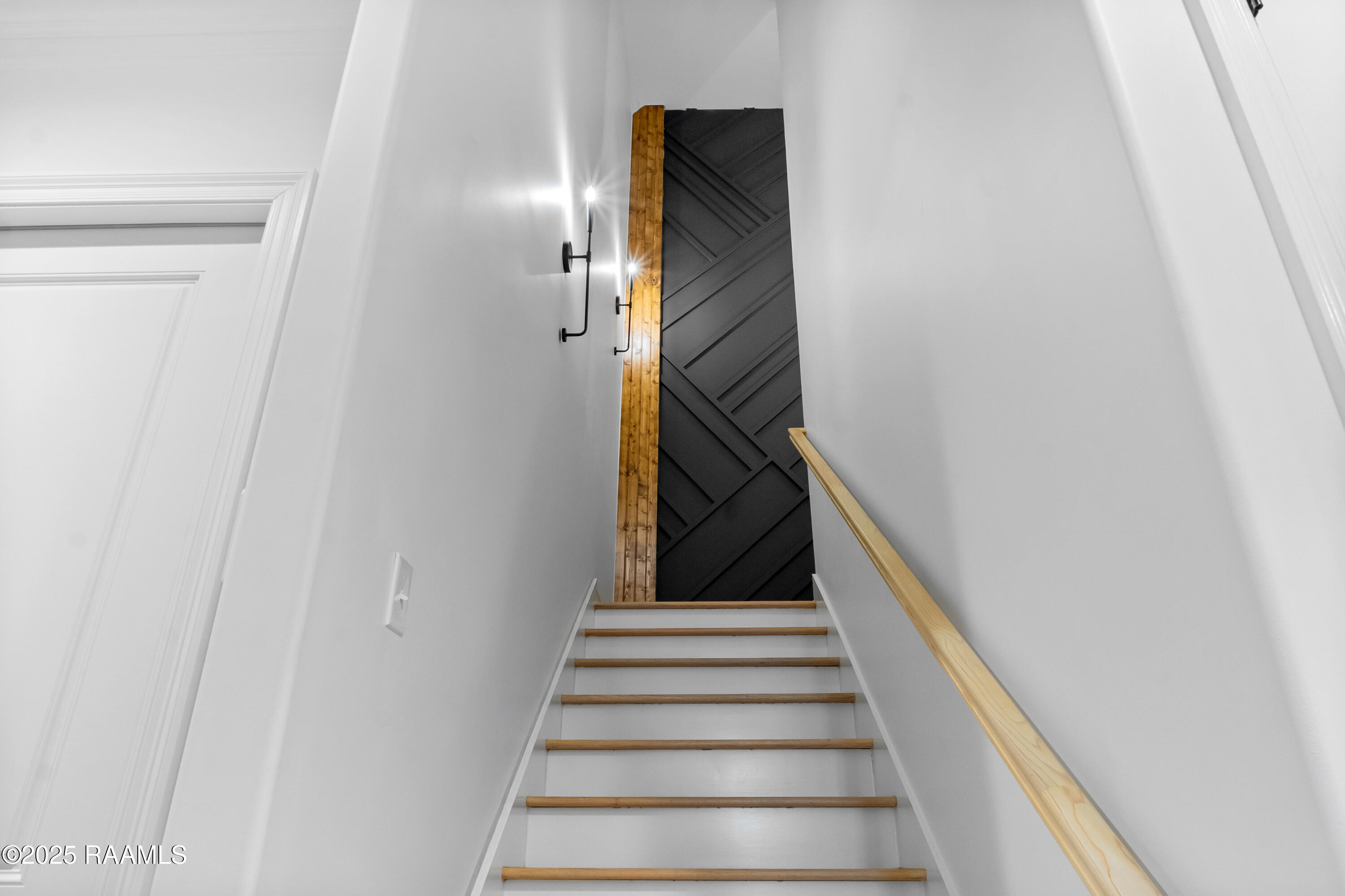 209 Stoney Shadow Drive Lafayette, LA 70508 - Photo 33 of 42 feature wall at the top of the stairs