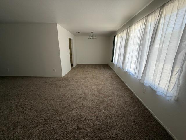 2601 Temperate Court Modesto, CA 95358 - Photo 8 of 24 wooden floor and window in an empty room