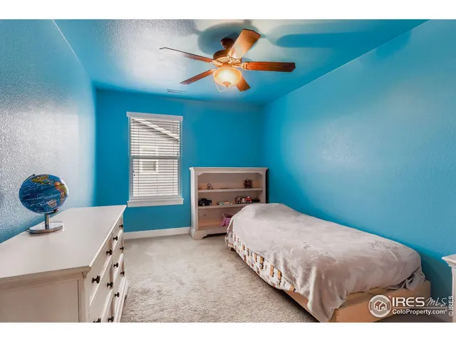 a bedroom with a bed and cabinets