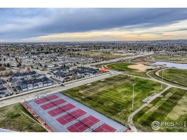 a view of a pool an outdoor space and seating area