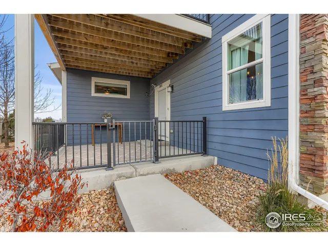 a view of a porch with a wooden fence