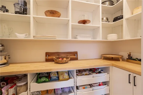 a kitchen with a stove and cabinets