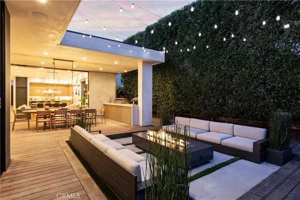 a outdoor living space with furniture and a potted plant