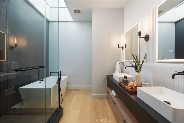 a room with a table chairs and a kitchen view