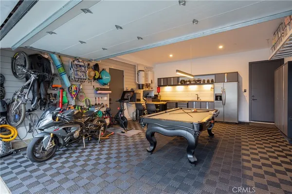 a living room with lots of furniture and a chandelier