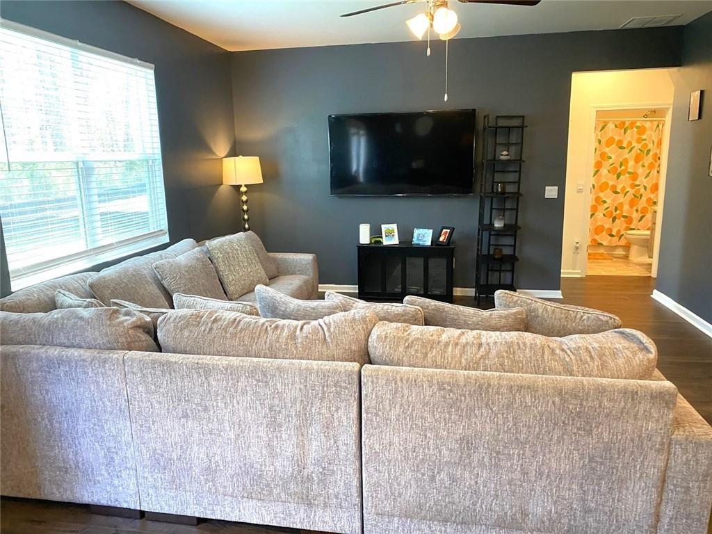 676 Whitman Lane Stockbridge, GA 30281 - Photo 11 of 50 a bedroom with bed tv and window