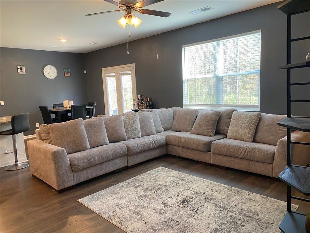 676 Whitman Lane Stockbridge, GA 30281 - Photo 12 of 50 a living room with furniture and a large window