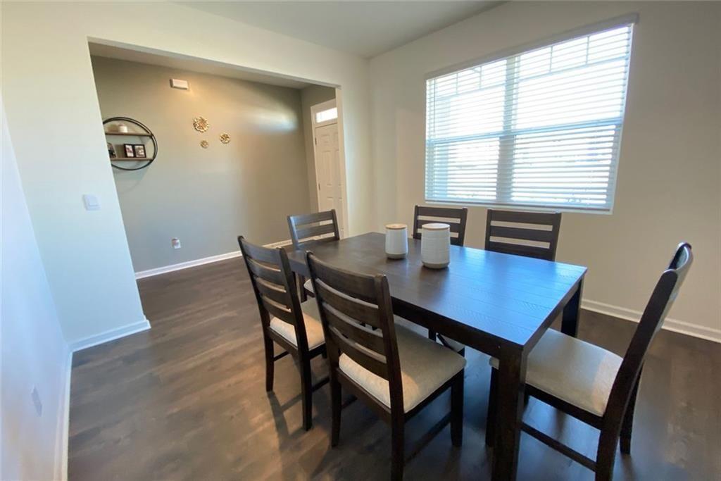676 Whitman Lane Stockbridge, GA 30281 - Photo 14 of 50 a view of a dining room with a table and chairs