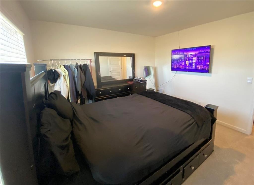 676 Whitman Lane Stockbridge, GA 30281 - Photo 25 of 50 a bedroom with a bed and window