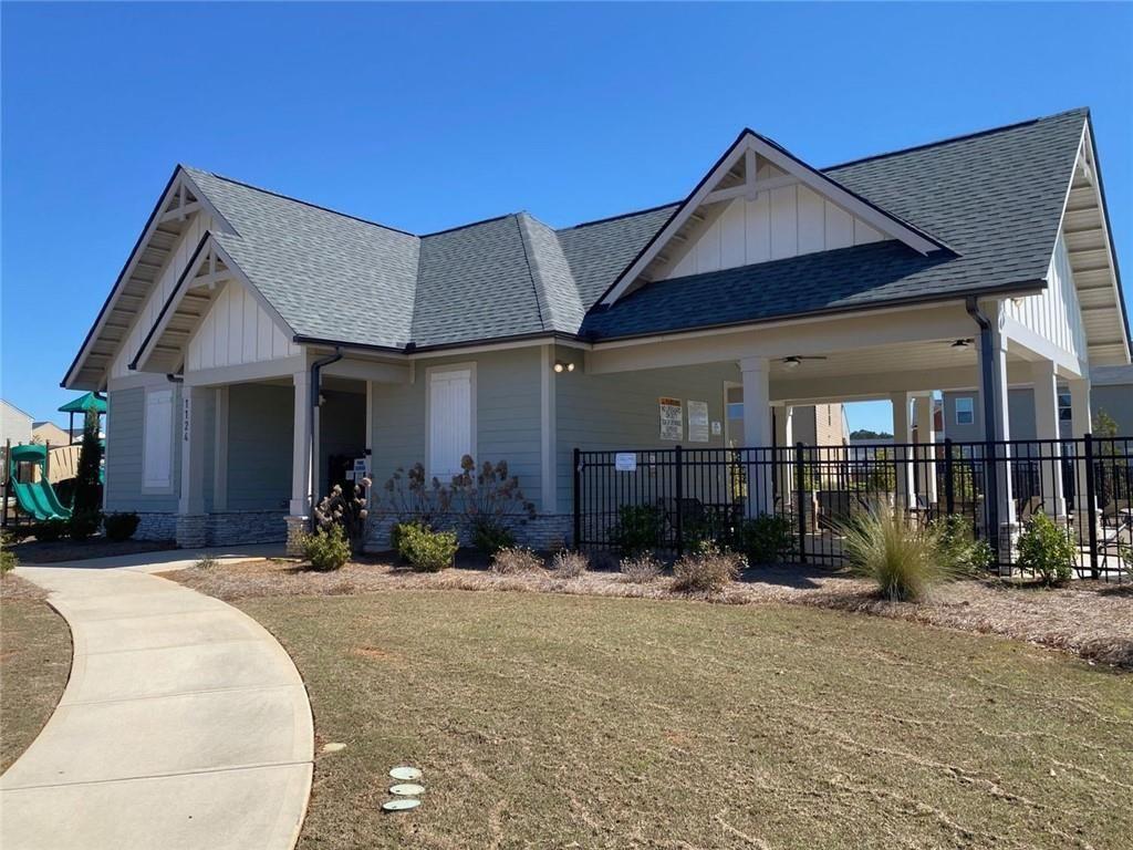 676 Whitman Lane Stockbridge, GA 30281 - Photo 36 of 50 a front view of a house with a yard