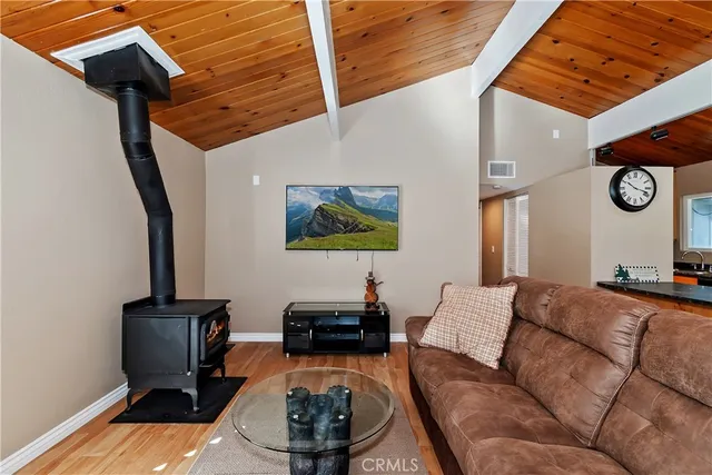 a living room with furniture and a mirror